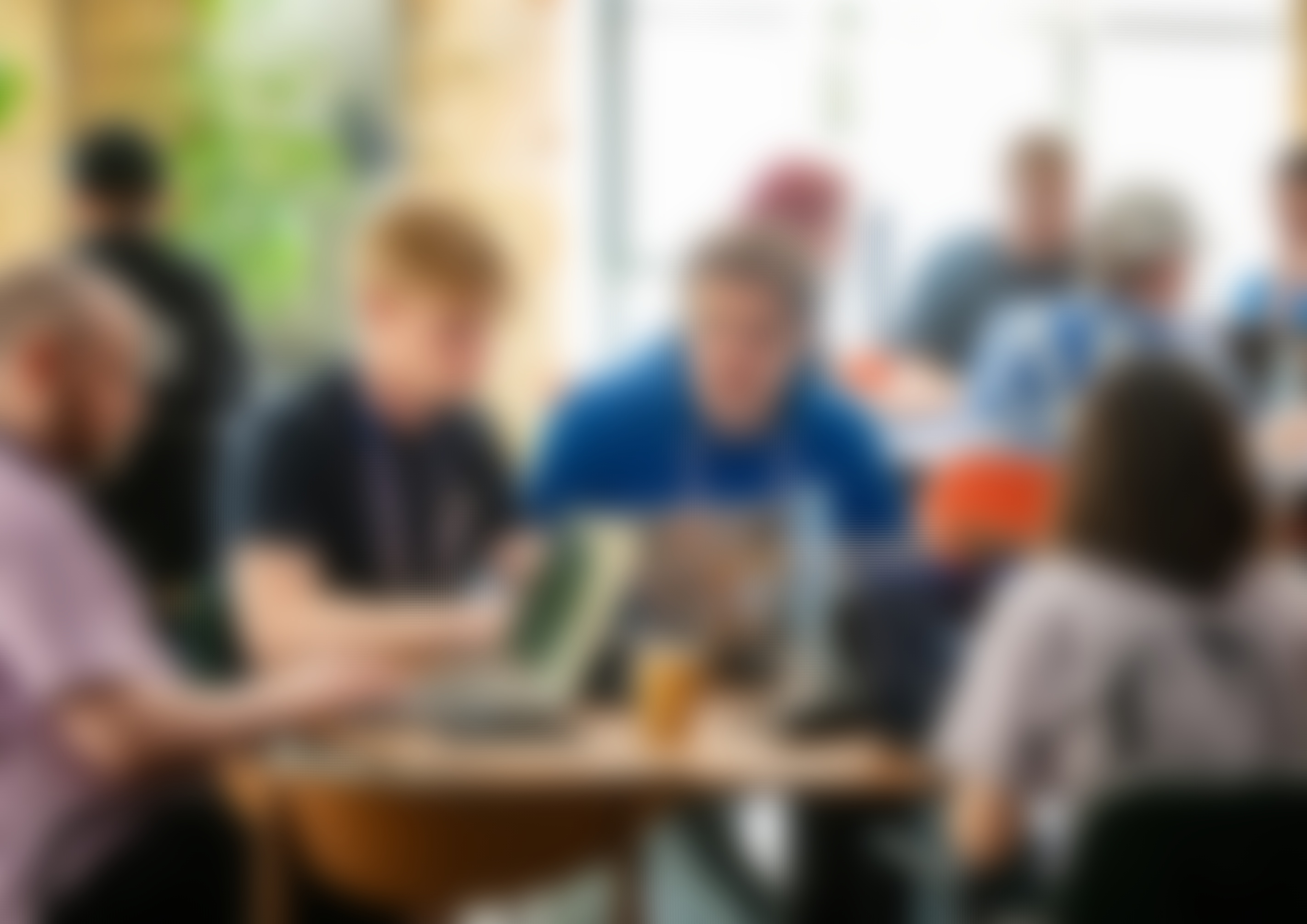 A group of developers are sitting by their computers hacking at Codegarden