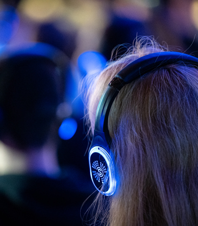 Person wearing headphones and listening to talk.jpg